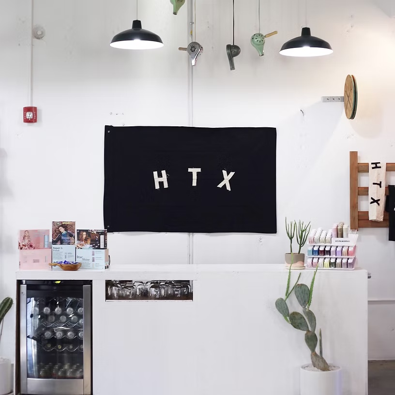 Do or Dye HTX black HTX banner and salon retail area