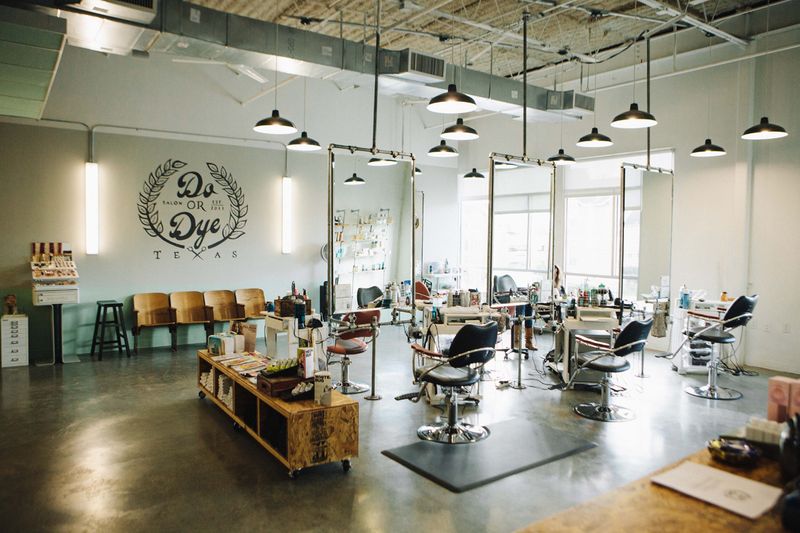 Do or Dye HTX salon interior with stylist working with a client